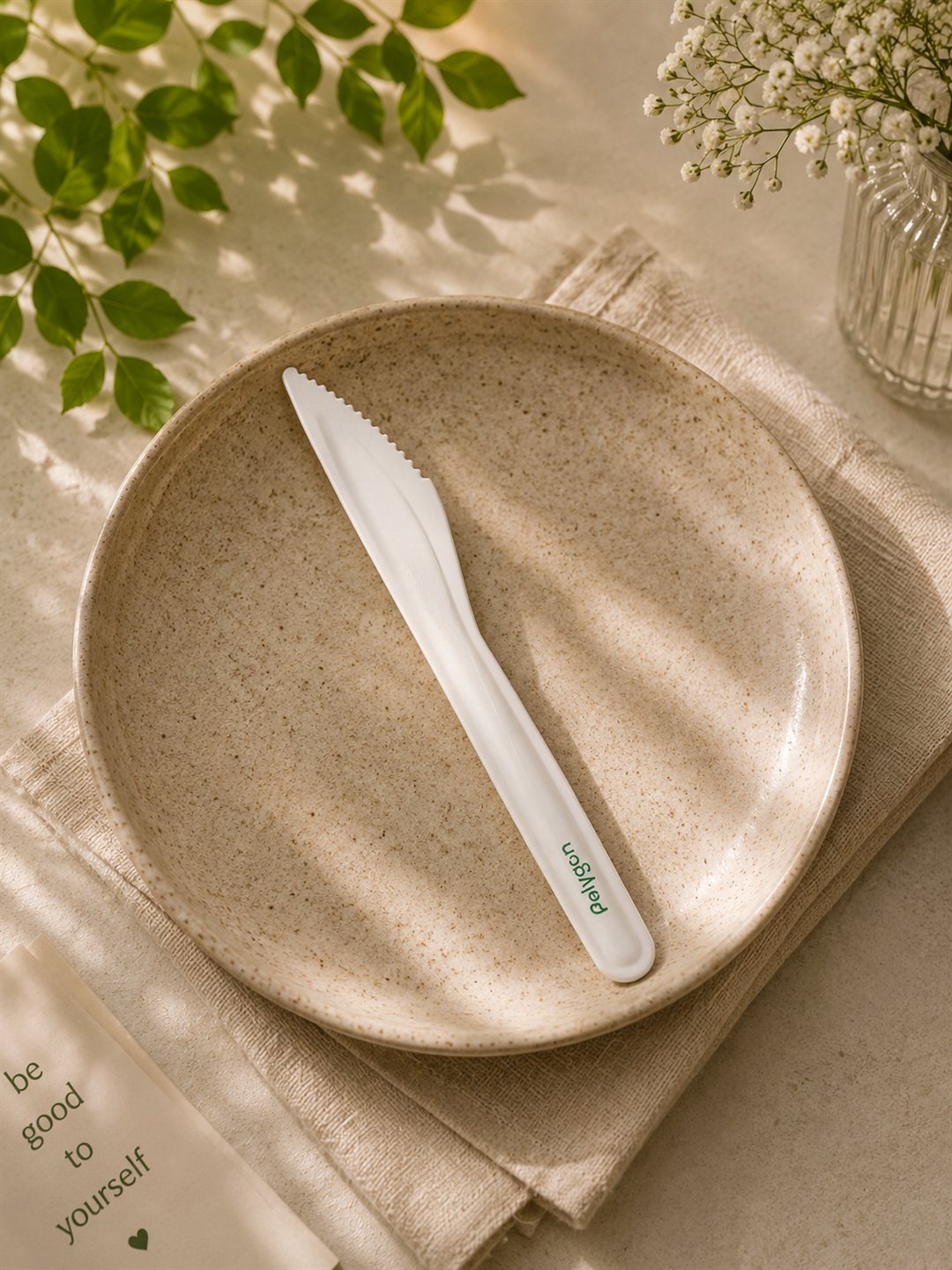 Compostable paper knife styled on a plate